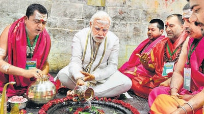 Prime Minister Narendra Modi offers prayers at Baba Baidyanath Dham, in Deoghar on Tuesday. (PTI) Prime Minister Narendra Modi offers prayers at Baba Baidyanath Dham, in Deoghar on Tuesday. (PTI)