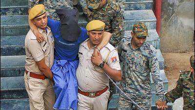 The seven accused arrested in Udaipur tailor Kanhaiya Lal’s murder case were presented in the NIA court in Jaipur on Tuesday amid tight security. (PTI) The seven accused arrested in Udaipur tailor Kanhaiya Lal’s murder case were presented in the NIA court in Jaipur on Tuesday amid tight security. (PTI)