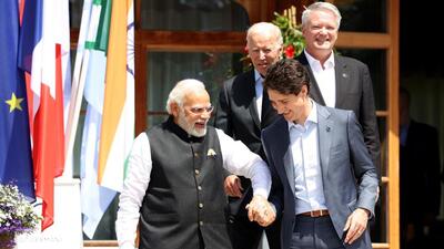 (L-R) Narendra Modi, India's Prime Minister, US President Joe Biden, Justin Trudeau, Canada's Prime Minister, and Mathias Cormann, secretary-general of the Organization for Economic Cooperation (OECD) at G-7 leaders summit at the Schloss Elmau luxury hotel in Elmau, Germany, on June 27, 2022. (Bloomberg) (L-R) Narendra Modi, India's Prime Minister, US President Joe Biden, Justin Trudeau, Canada's Prime Minister, and Mathias Cormann, secretary-general of the Organization for Economic Cooperation (OECD) at G-7 leaders summit at the Schloss Elmau luxury hotel in Elmau, Germany, on June 27, 2022. (Bloomberg)
