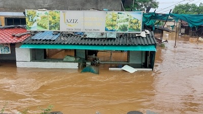 Shops get partially submerged in floodwater following heavy rainfall, in Gujarat's Navsari. ( DJ RAJ) Shops get partially submerged in floodwater following heavy rainfall, in Gujarat's Navsari. ( DJ RAJ)