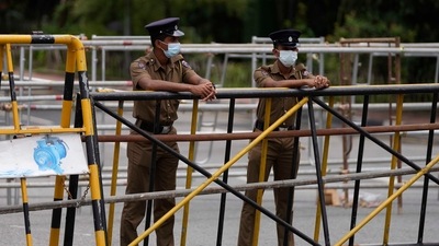 Police officers man a barricade at the entrance to the Sri Lankan parliament in Colombo, Sri Lanka, (AP) Police officers man a barricade at the entrance to the Sri Lankan parliament in Colombo, Sri Lanka, (AP)