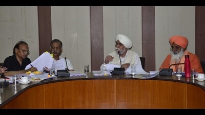 Members of the NGT monitoring committee during a meeting with officials of the district administration at Bachat Bhawan in Ludhiana on Tuesday. (Harvinder Singh/HT)