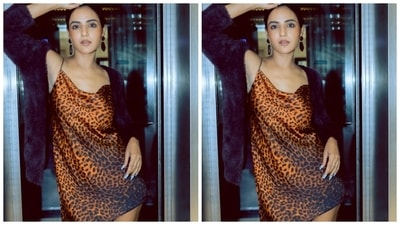 Coming to the design details, Jasmin's slip dress comes replete with animal patterns done in orange and black hues. The ensemble is made from a silk satin fabric and hugs the actor's svelte frame. It is an ideal pick for going out on a casual date with your girlfriends or chilling at home with your partner. (Instagram) Coming to the design details, Jasmin's slip dress comes replete with animal patterns done in orange and black hues. The ensemble is made from a silk satin fabric and hugs the actor's svelte frame. It is an ideal pick for going out on a casual date with your girlfriends or chilling at home with your partner. (Instagram)