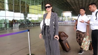 Malaika Arora was seen at the Mumbai airport on Tuesday morning as she left for Goa. She was dressed up in a striped blazer and pants and also shared a picture from the airport as well as from Goa. She recently returned from Paris where she celebrated boyfriend Arjun Kapoor's 37th birthday. (Varinder Chawla) 
