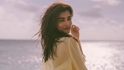 Pooja Hegde in bikini and see-through shirt gets some Vitamin D after taking a dip in the sea (Instagram) Pooja Hegde in bikini and see-through shirt gets some Vitamin D after taking a dip in the sea (Instagram)