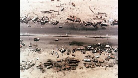 Aerial view of destroyed Iraqi vehicles beside Highway 80, west of Kuwait City. The ‘Highway of Death ‘ was bombed by coalition forces on February 27-28 1991 during Gulf War 1. (Shutterstock)
