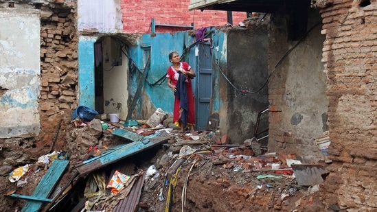 A portion of a dilapidated wall collapsed in Pune's Nana peth following heavy rains.(HT_PRINT)