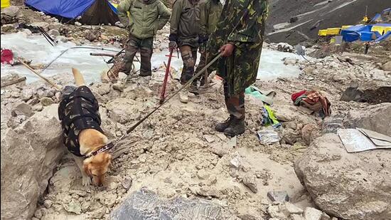 Rescuers at the flash flood-hit base camp on Saturday. (ANI)