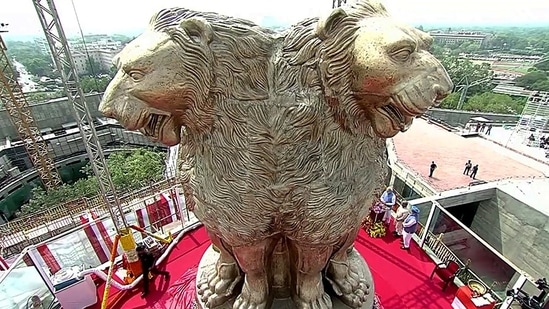 A 6.5m long bronze National Emblem cast unveiled by the Prime Minister Narendra Modi on the roof of the New Parliament Building, in New Delhi.(ANI)