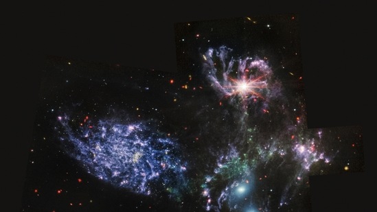 This image provided by NASA shows Stephan's Quintet, a visual grouping of five galaxies captured by the Webb Telescope's Mid-Infrared Instrument (MIRI).(AP)