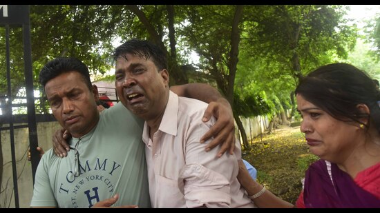 The inconsolable relatives of the deceased outside ESI Hospital near Bharat Nagar Chowk in Ludhiana on Tuesday. (Gurpreet Singh/HT)