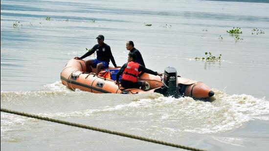 Guwahati, July 06 (ANI): Personnel of SDRF, Assam conduct a Rescue operation in the Brahmaputra river after two persons drowned in the river, in Guwahati on Wednesday. (ANI Photo) (Pitamber Newar)