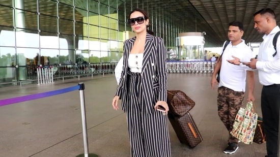 Malaika Arora was seen at the Mumbai airport on Tuesday morning as she left for Goa. She was dressed up in a striped blazer and pants and also shared a picture from the airport as well as from Goa. She recently returned from Paris where she celebrated boyfriend Arjun Kapoor's 37th birthday. (Varinder Chawla)