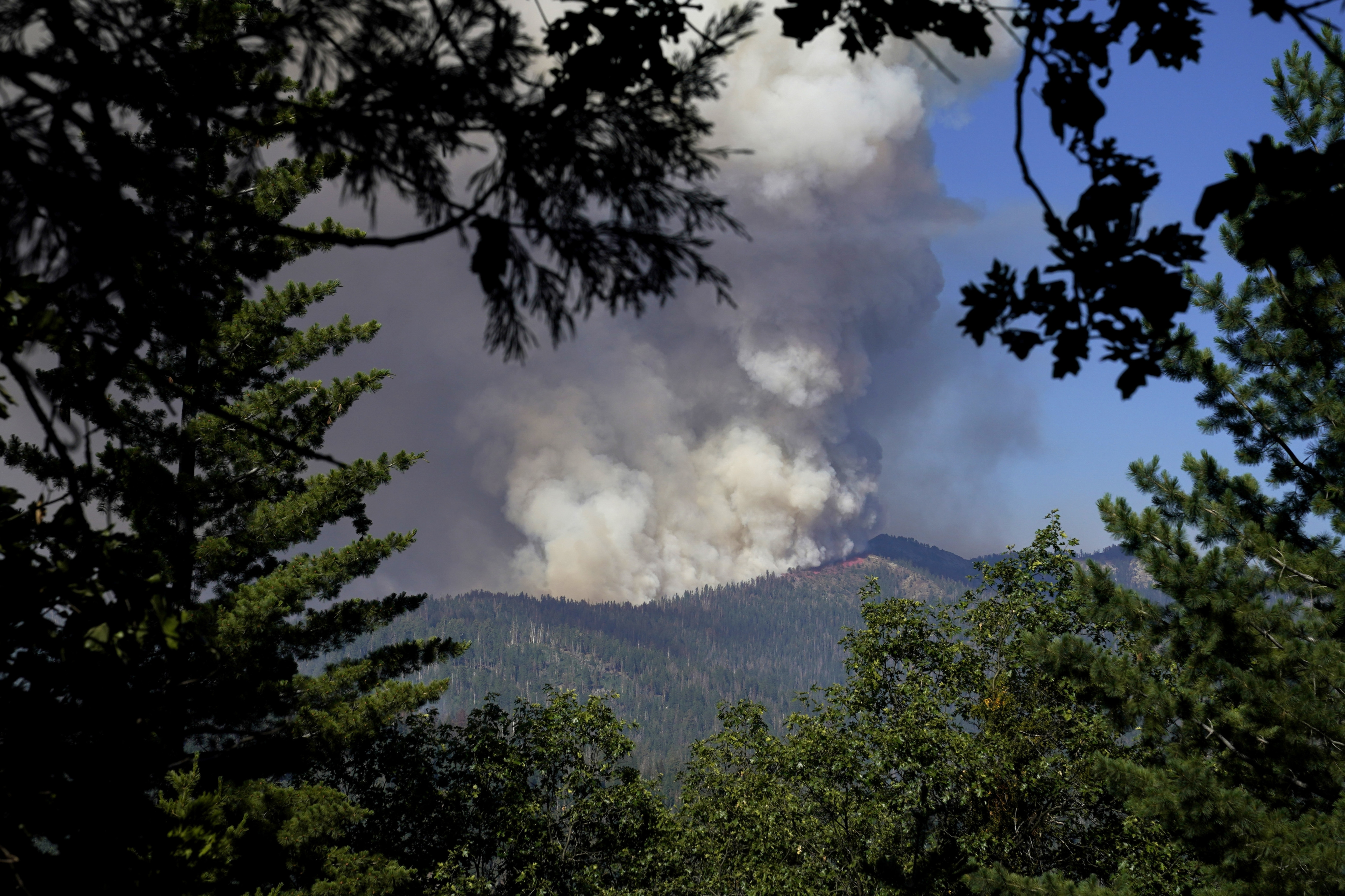 The Washburn Fire can be seen from unincorporated Mariposa County, California, as it continues to burn in Yosemite National Park on Monday. (AP) The Washburn Fire can be seen from unincorporated Mariposa County, California, as it continues to burn in Yosemite National Park on Monday. (AP)