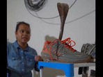 A woman is seen trying to rescue a snake hiding inside a shoe. (Twitter/@susantananda3) A woman is seen trying to rescue a snake hiding inside a shoe. (Twitter/@susantananda3)