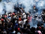 Demonstrators gather outside the office of Sri Lanka's Prime Minister Ranil Wickremesinghe in Colombo on Wednesday.