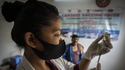 A nurse prepares to administer vaccine for Covid-19 at a private vaccination centre&nbsp; (AP)