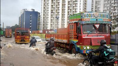The road leading to Phase III in Hinjewadi IT Park was waterlogged due to heavy rains in Pune. (HT PHOTO)