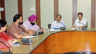 Additional deputy commissioner Amit Kumar Panchal chairing a meeting to discuss the district level Independence Day celebrations at Bachat Bhawan in Ludhiana on Wednesday. (HT Photo)