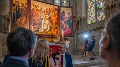 Painter Michael Triegel interviewed in front of his work, the new altarpiece for Naumburg Cathedral (Falko Matte/Vereinigte Domstifter) Painter Michael Triegel interviewed in front of his work, the new altarpiece for Naumburg Cathedral (Falko Matte/Vereinigte Domstifter)