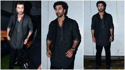 Ranbir completed the set with an embellished sleeveless bandhgala jacket featuring an open front and intricate design. He styled the outfit with a silver hoop earring, a leather strap watch, black dress shoes, a back-swept hairdo, and a rugged short beard. (HT Photo/Varinder Chawla)