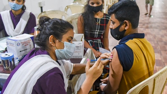 A beneficiary receiving a dose of Covid-19 vaccine from a healthworker. (FILE PHOTO)