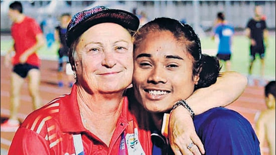 Hima Das; (inset) with her coach Galina Bukharina