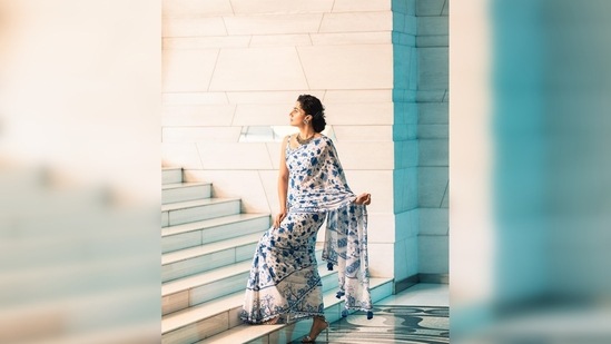 Taapsee Pannu extended her left arm and held her pallu while she placed her right hand on her saree and struck an elegant pose for the camera.(Instagram/@taapsee)