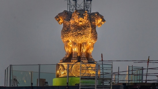 Newly unveiled National Emblem cast made of bronze on the roof of new Parliament House building, in New Delhi.