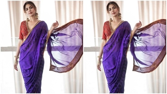 Rhea teamed the purple saree with a heavily embroidered blouse in a contrasting red shade. It features a plunging V neckline adorned with a patti border, intricate handiwork on the torso, half sleeves, and a back cut-out with tassel-adorned ties.(Instagram)