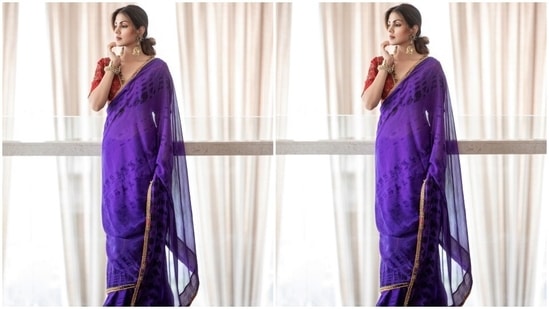 The photos show Rhea in a purple-coloured saree featuring a tie-dye pattern in a matching shade and a sequin embellished gota patti embroidered on the borders. Rhea draped the six yards in traditional style, letting the pallu fall from her shoulders.(Instagram)