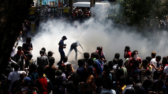 Demonstrators gather outside the office of Sri Lanka's Prime Minister Ranil Wickremesinghe, amid protests over the country's economic crisis, in Colombo, Sri Lanka, on Wednesday. (REUTERS/Adnan Abidi)