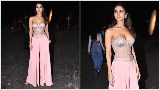 Vaani teamed the corset top with blush-pink pants featuring a high-rise waistline, pleats on the front, and a flared silhouette. In the end, strappy peep-toe sandals adorned with diamantes completed Vaani's promotional attire.(HT Photo/Varinder Chawla)