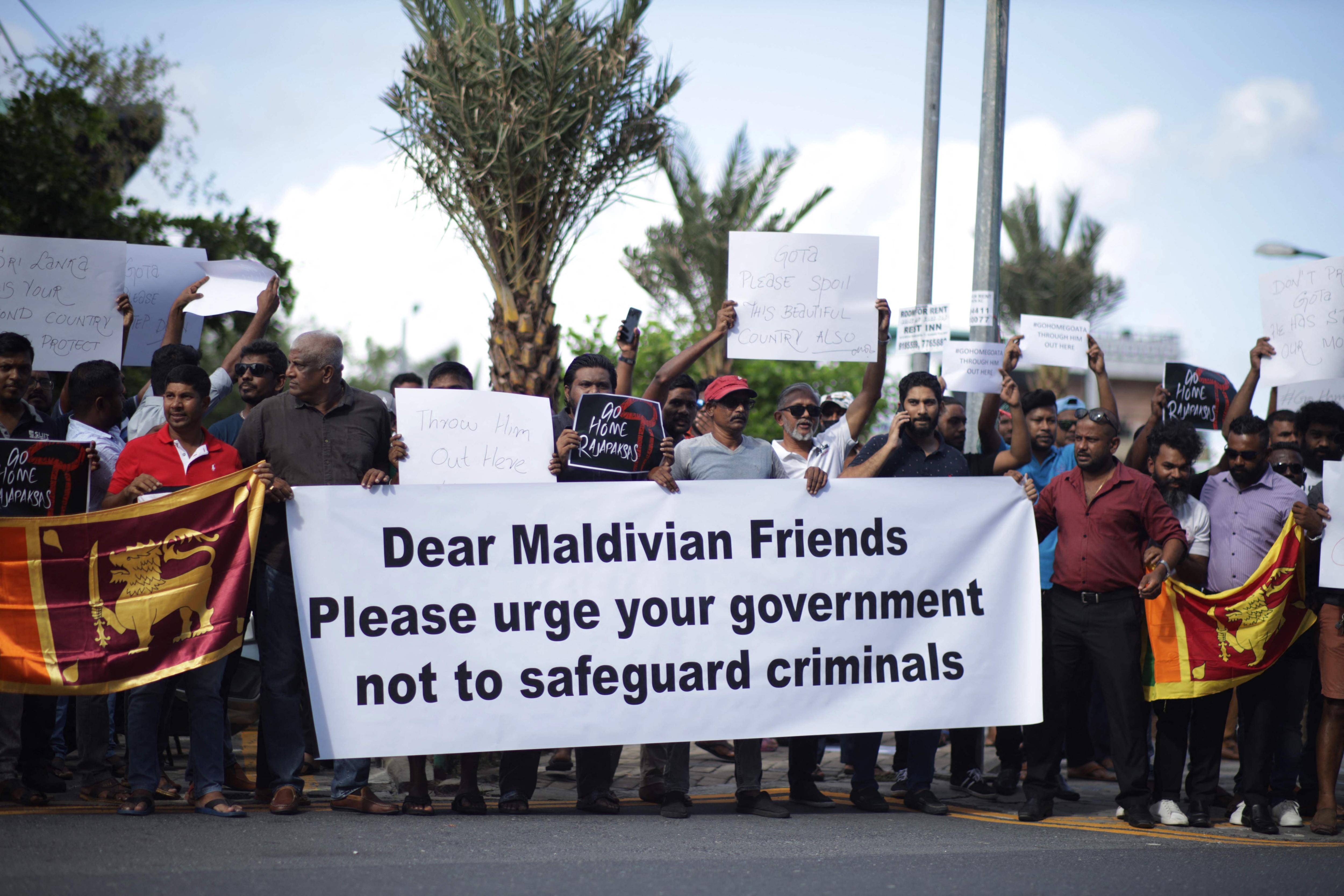 Sri Lankans living in the Maldives stage a demonstration in Male on July 13, 2022. (AFP) Sri Lankans living in the Maldives stage a demonstration in Male on July 13, 2022. (AFP)