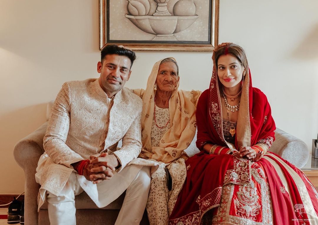 Sangram Singh and Payal Rohatgi with a family elder.&nbsp;