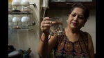 A resident of Army CHS shows the contaminated water. The water supplied in parts of Nerul (E) is not fit for drinking, said test reports of NMMC. (BACHCHAN KUMAR/HT PHOTO) A resident of Army CHS shows the contaminated water. The water supplied in parts of Nerul (E) is not fit for drinking, said test reports of NMMC. (BACHCHAN KUMAR/HT PHOTO)