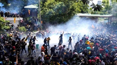 Sri Lanka: Police use tear gas to disperse the protesters who stormed the compound of prime minister Ranil Wickremesinghe 's office.&nbsp; (AP)
