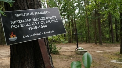A symbolic grave in the Bialucki Forest near Ilowo the site where the mass grave of about 8,000 Geman Nazi victims from the nearby Soldau concentration camp in Dzialdowo was unearthed at the beginning of July 2022.&nbsp; (AFP)