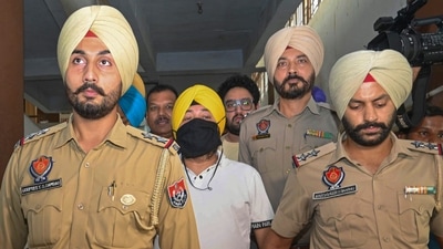 Patiala: Punjabi singer Daler Mehndi being taken to jail after being sentenced to two years in jail for his involvement in a human trafficking case. (PTI Photo) Patiala: Punjabi singer Daler Mehndi being taken to jail after being sentenced to two years in jail for his involvement in a human trafficking case. (PTI Photo)