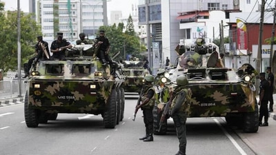 Sri Lankan Army on board armored carriers patrolling main routes in Colombo to maintain law and order. Sri Lankan Army on board armored carriers patrolling main routes in Colombo to maintain law and order.