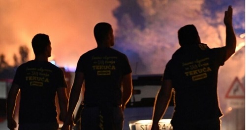 Firefighters watch a wildfire burning near Zaton, Croatia. (AP Photo)