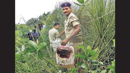 Policemen recover illicit liquor from a field in Bihar’s Gopalganj district on August 2016. (PTI)