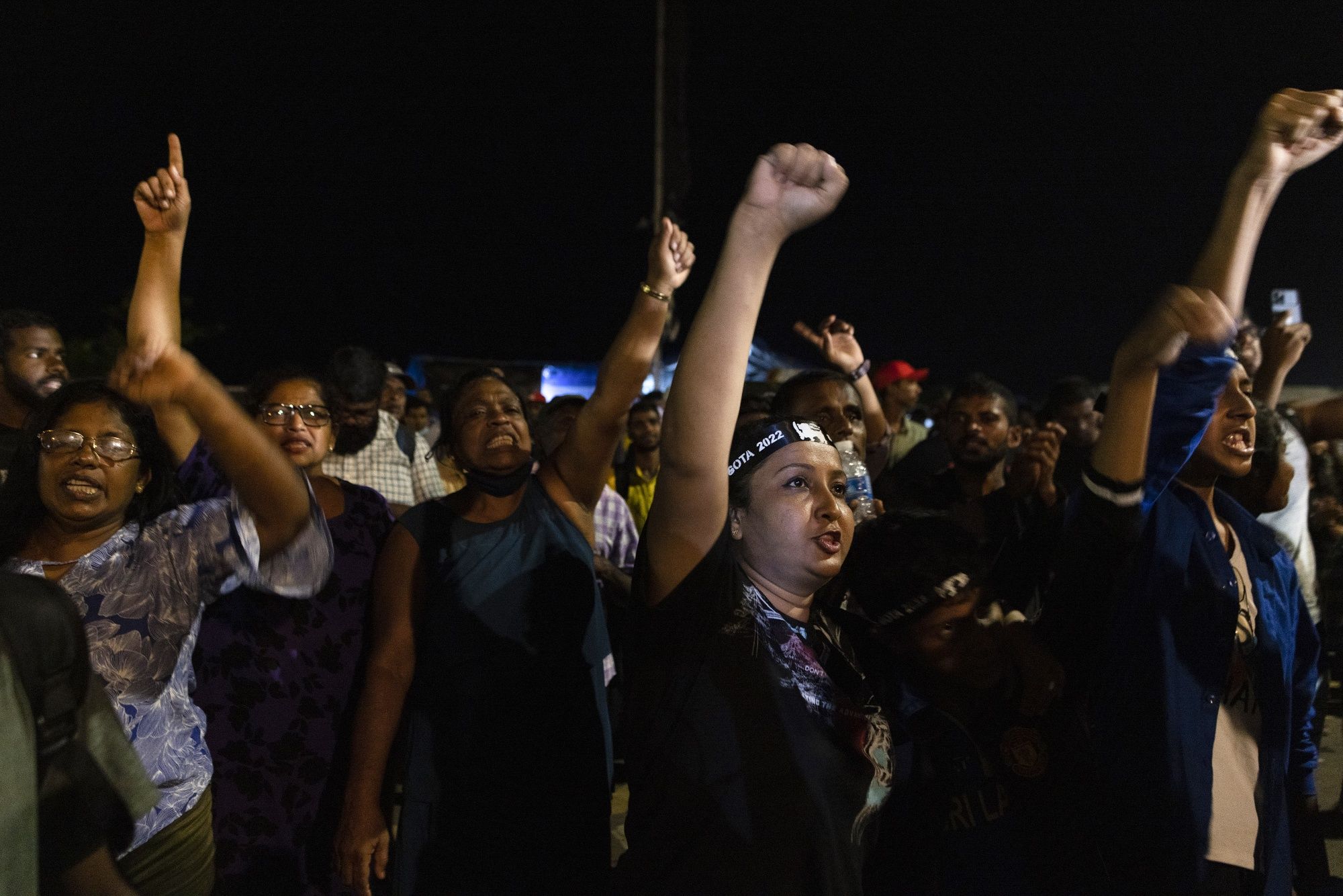Demonstrators cheer after hearing news that Gotabaya Rajapaksa, Sri Lanka's president, emailed a letter of resignation, at a protest site close to the president's office in Colombo, Sri Lanka, on Thursday, July 14, 2022. (Buddhika Weerasinghe/Bloomberg) Demonstrators cheer after hearing news that Gotabaya Rajapaksa, Sri Lanka's president, emailed a letter of resignation, at a protest site close to the president's office in Colombo, Sri Lanka, on Thursday, July 14, 2022. (Buddhika Weerasinghe/Bloomberg)
