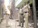 Delhi Police personnel outside the residence of the man who shot his wife and daughters and killed himself in Jaffrabad. (HT PHOTO)