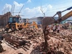 Rescue operation underway to save people trapped under debris following the collapse of a wall in an under-construction godown, at Alipur area in New Delhi, Friday, July 15, 2022.&nbsp;
