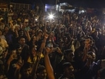 Demonstrators cheer after hearing the news that Gotabaya Rajapaksa, resigned from the President's post at a protest site close to the president's office in Colombo.(Bloomberg)