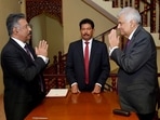 Sri Lankan President's Office, interim President Ranil Wickremesinghe, right, greets Chief Justice Jayantha Jayasuriya during the oath-taking ceremony in Colombo, Sri Lanka.