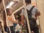 Screenshot from the viral video of a girl slapping a boy inside the coach.&nbsp;