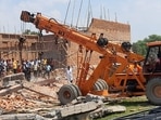 Rescue operations are underway at the spot of the wall collapse in Alipur region, Delhi. (HT Photo)