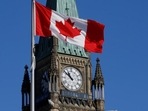 A Canada flag flies in front of the Peace Tower on Parliament Hill in Ottawa, Ontario. A Canada flag flies in front of the Peace Tower on Parliament Hill in Ottawa, Ontario.